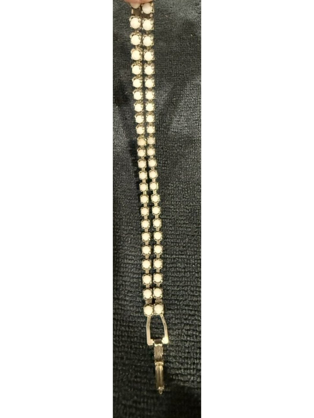 vintage, unbranded double-row whitish  tennis bracelet in a silver-tone setting